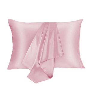 Light pink satin pillow with a matching draped scarf laid across it for a decorative look.